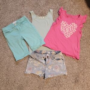 4 pieces- 2 shorts, Tank top, Ruffle shelvesless shirt.